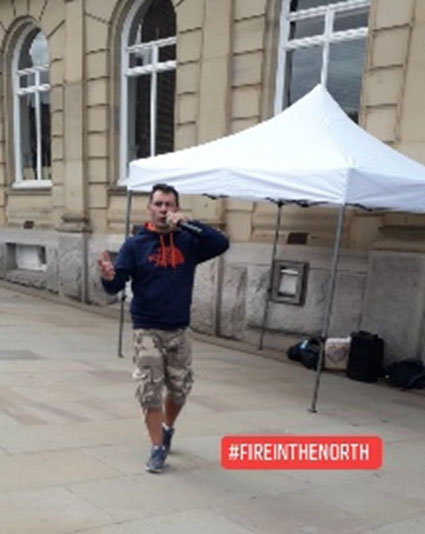 A photo of Wayne preaching in Rochdale