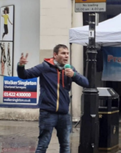 A photo of Wayne preaching in Halifax